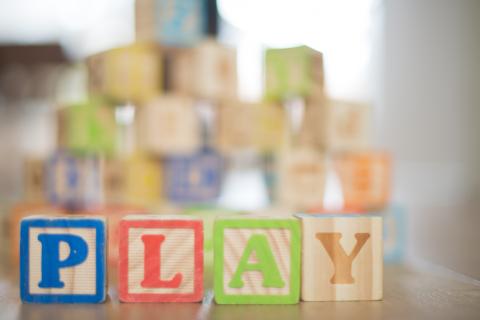Blocks that spell out PLAY.