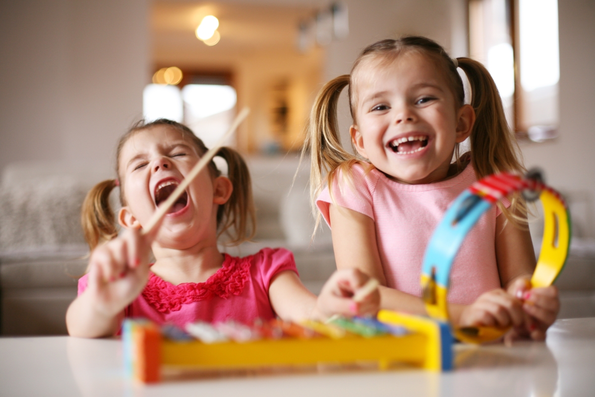 Young girls playing musical instruments. 